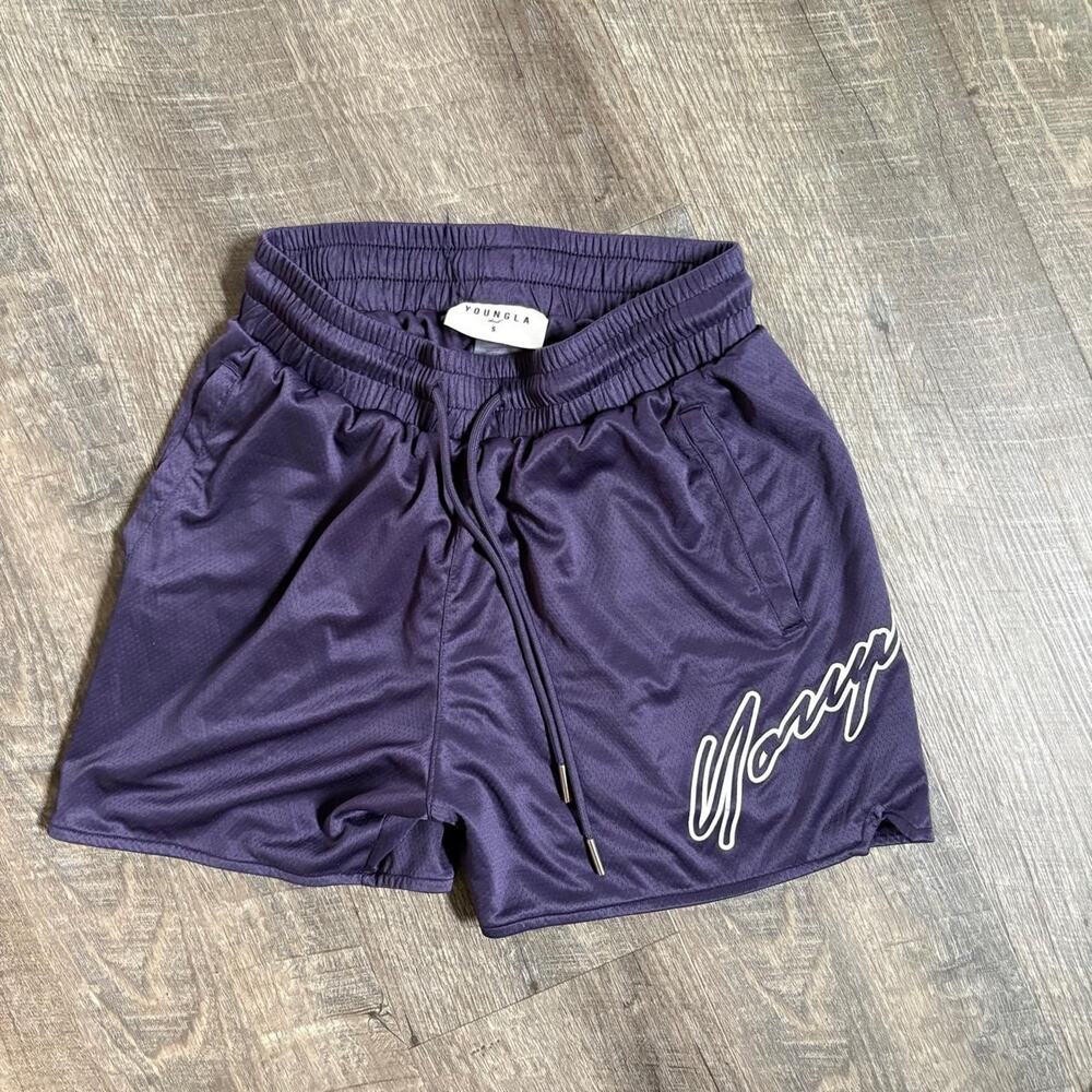 Purple shorts with white logo